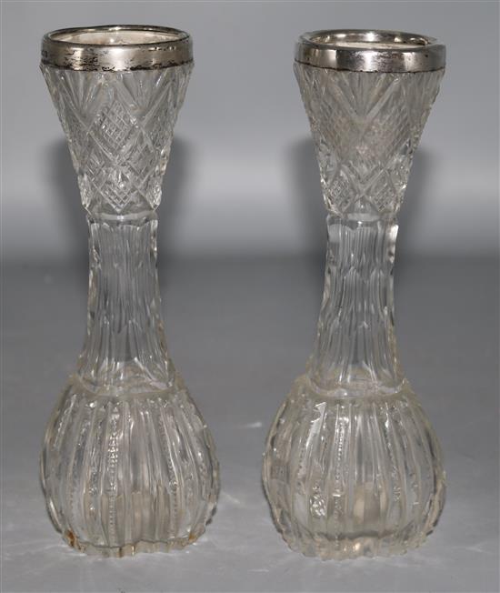 A pair of Edwardian silver rimmed cut glass vases, one unmarked, 7.5in.